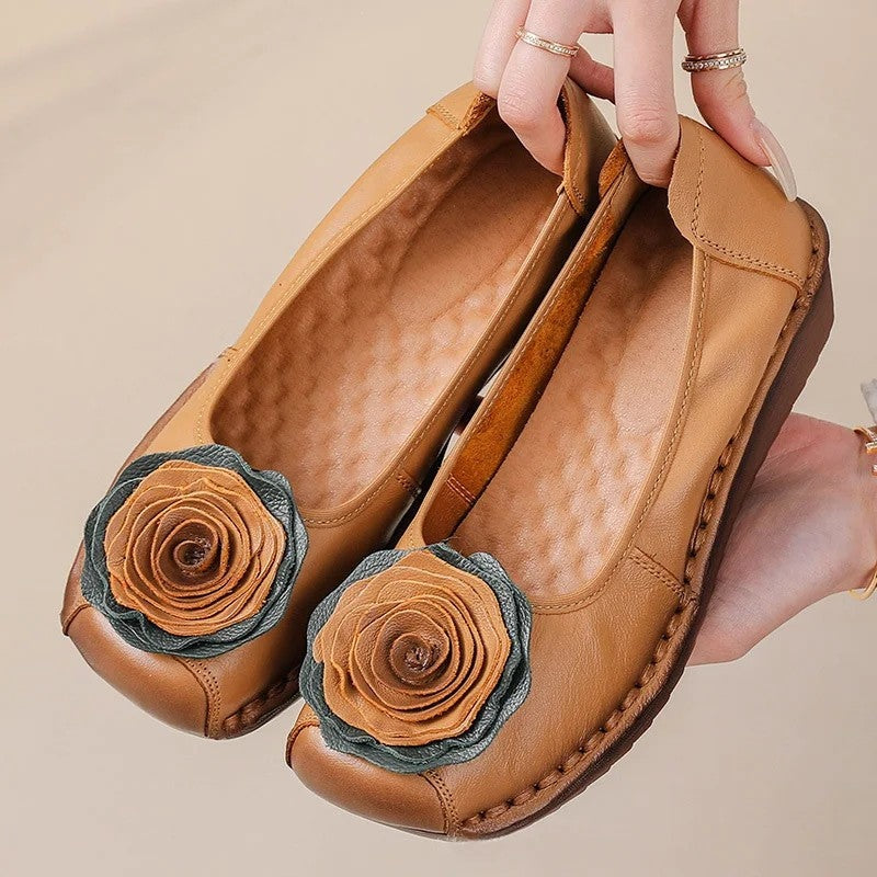 Comfortable women's slip-on loafers, adorned with charming floral appliqué for stylish wear.