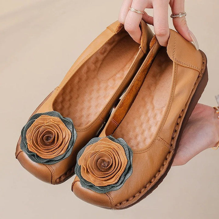 Comfortable women's slip-on loafers, adorned with charming floral appliqué for stylish wear.