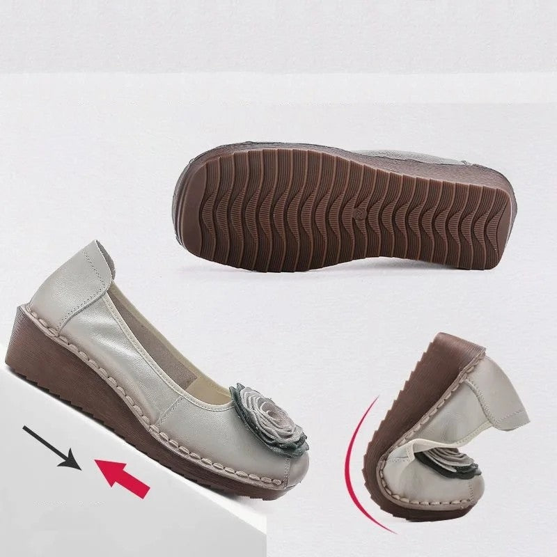 Chic women's casual flats, featuring vibrant floral appliqué and a comfortable slip-on design.