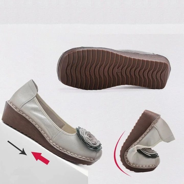 Chic women's casual flats, featuring vibrant floral appliqué and a comfortable slip-on design.