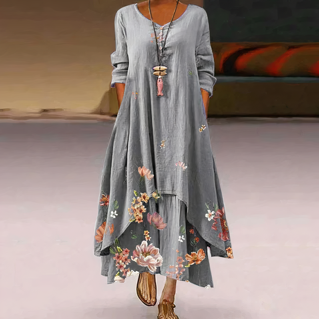 Spring/Summer women's long sleeve maxi dress. Flowy oversized style with a vibrant floral border print.