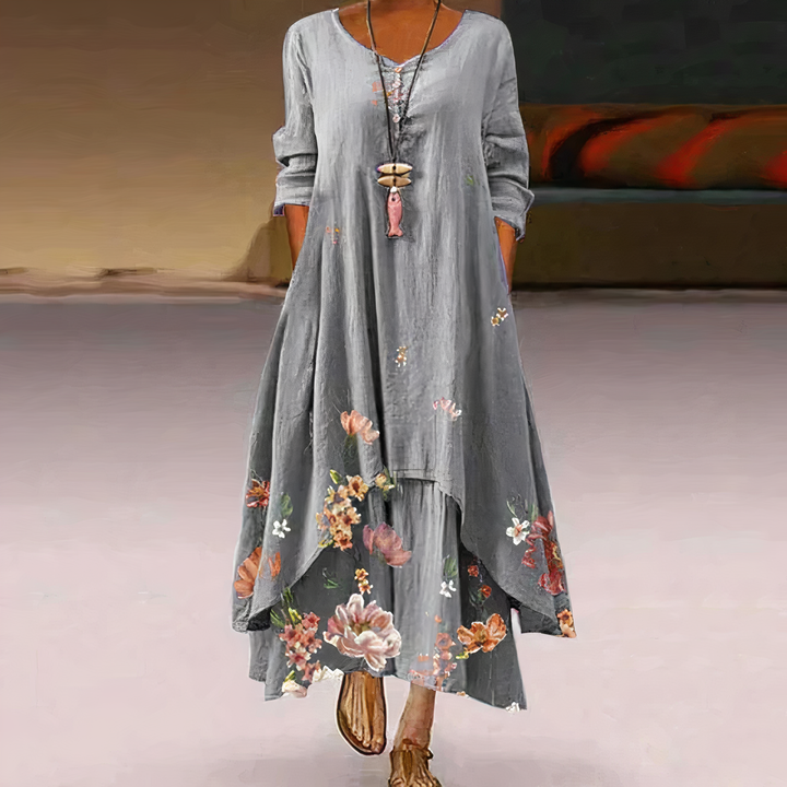 Spring/Summer women's long sleeve maxi dress. Flowy oversized style with a vibrant floral border print.