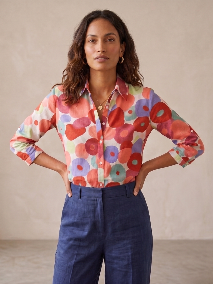 Women's floral button-down blouse with roll-tab sleeves, featuring a relaxed fit for versatile spring and summer wear.