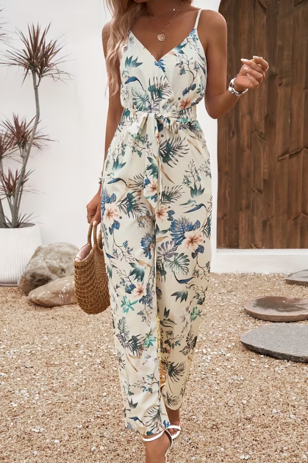 Women's floral cami jumpsuit with a tie waist for effortless summer style. Perfect for casual wear & vacations.