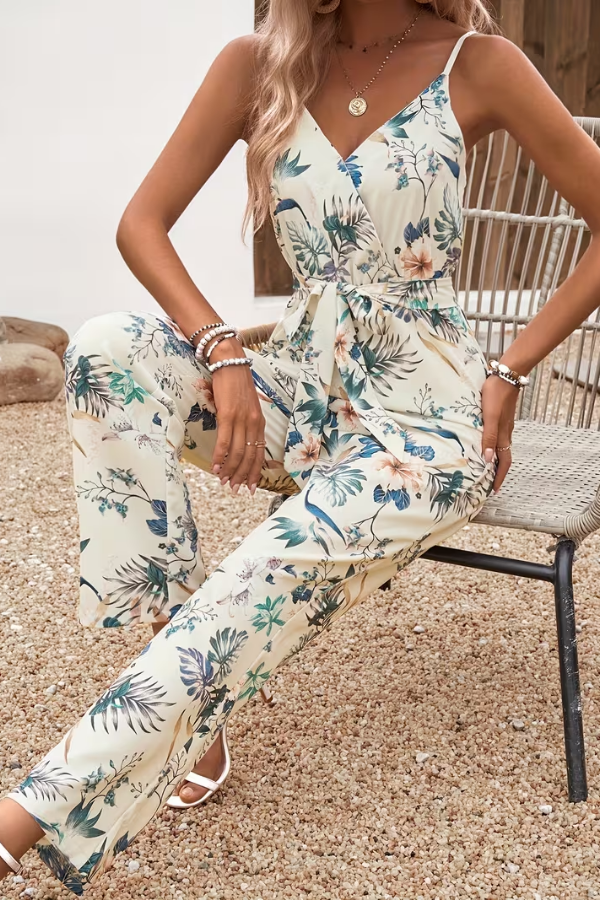 Elegant women's V-neck floral cami jumpsuit. Tie waist design, ideal for summer fashion, vacation & daywear.