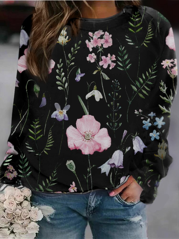 Women's long sleeve crew neck sweatshirt with elegant floral pattern. Soft, stylish, and versatile.