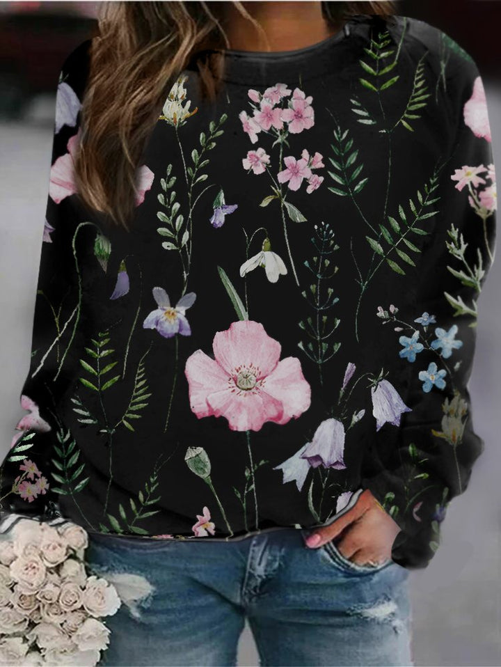 Women's long sleeve crew neck sweatshirt with elegant floral pattern. Soft, stylish, and versatile.