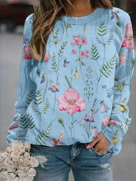 Vibrant floral print women's crew neck sweatshirt, comfortable long sleeve top. Great for autumn.