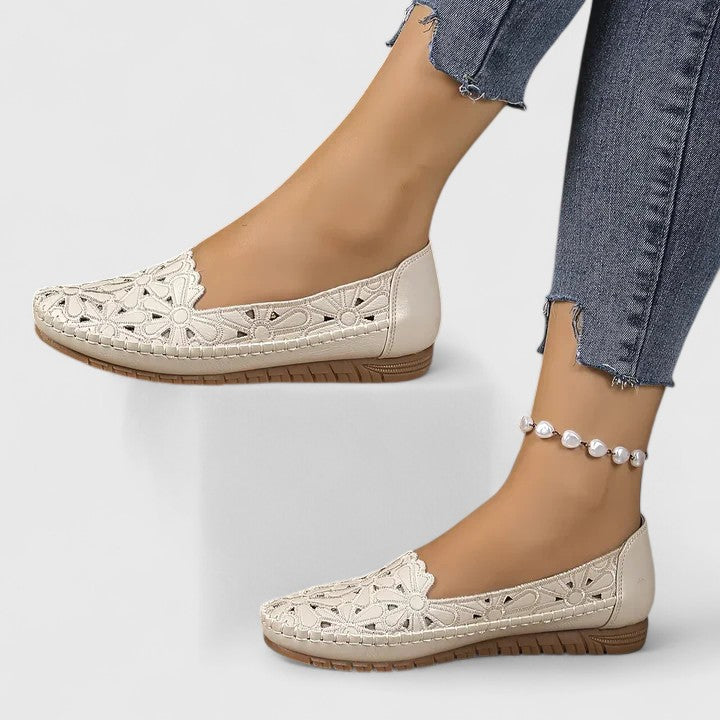 Ladies perforated floral cutout ballet flats, stylish round toe slip-ons for walking comfort.