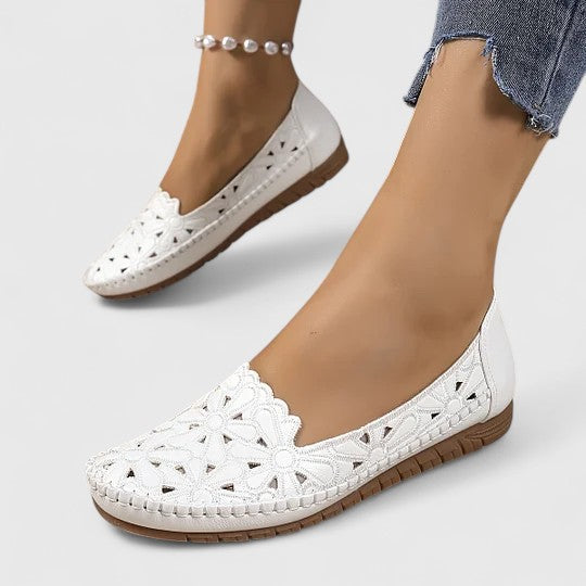 Stylish women's spring/summer ballet flats, featuring elegant floral cutouts & easy slip-on design.