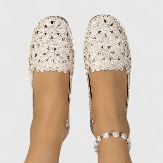 Comfortable women's ballet flats with delicate floral perforated design, perfect slip-on for daily walk.