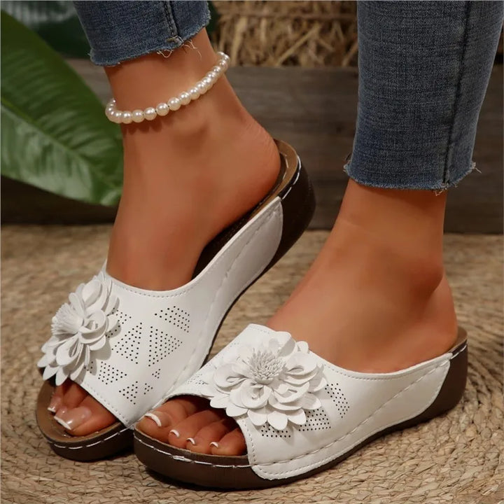 Vibrant women's floral pattern Elarie sandals, offering slip-on comfort.