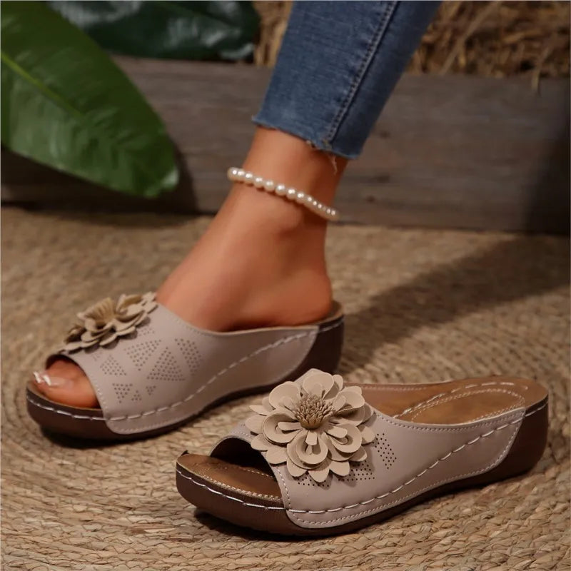 Open-toe women's floral Elarie slide sandals with decorative floral accents.