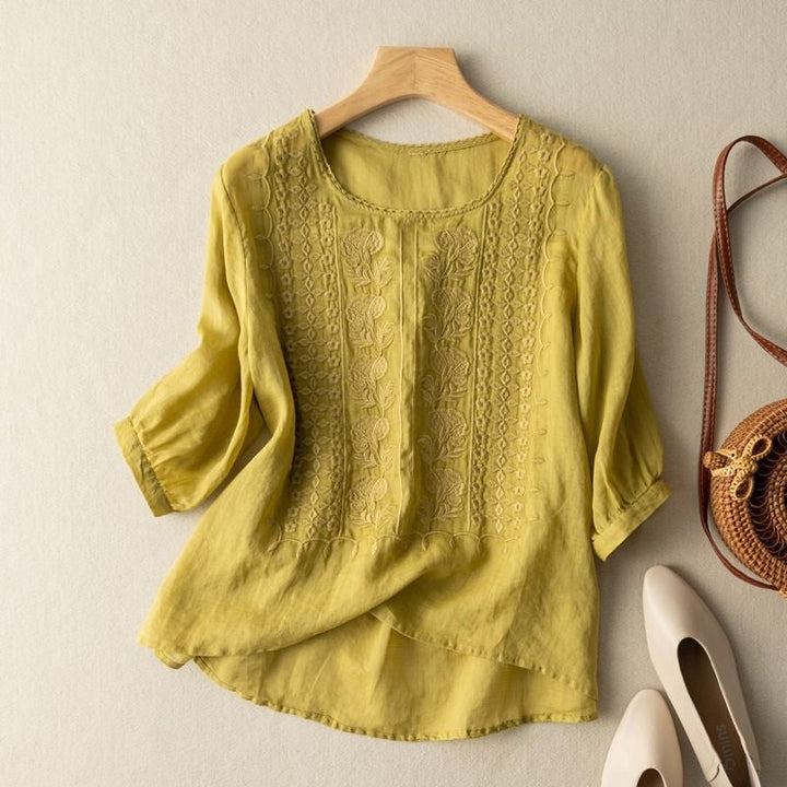 Women's floral embroidered blouse with long sleeves, relaxed fit & curved hem; ideal everyday top.