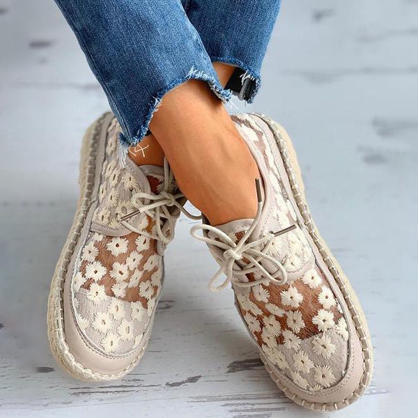 Elegant women's slip-on shoes with delicate floral embroidery, offering ultimate comfort and support.