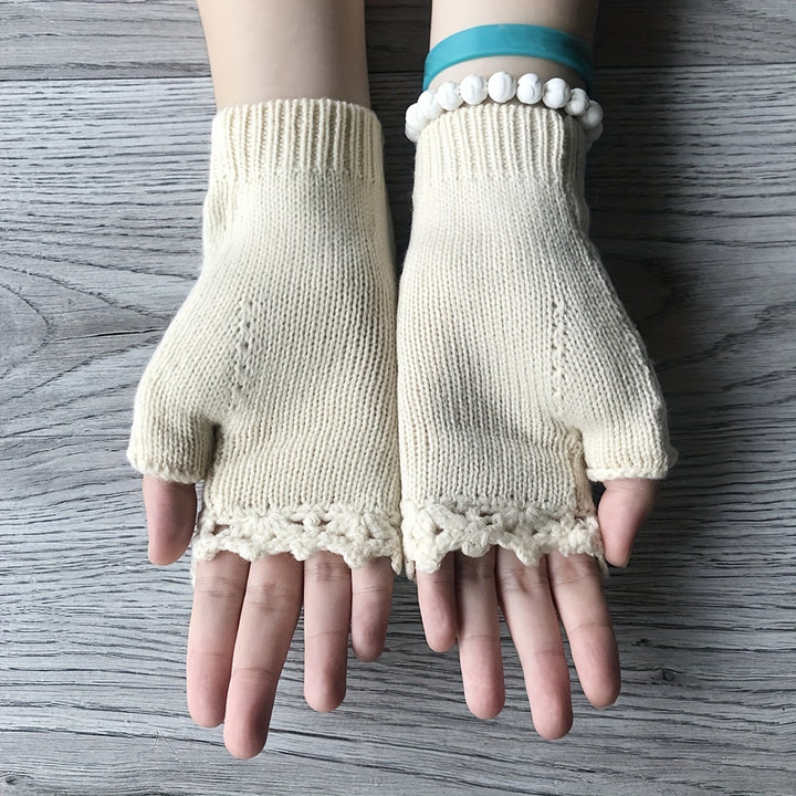 Stylish women's knit fingerless gloves with intricate floral embroidery, perfect for fall and winter.