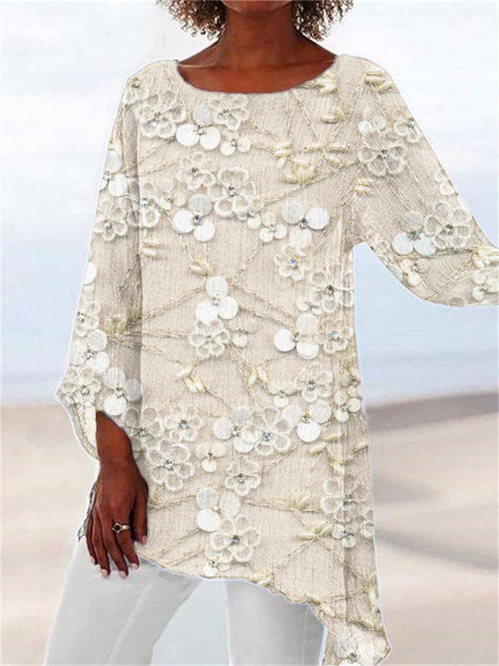 Women's floral embroidered tunic top with an asymmetrical hem, long sleeves, and relaxed fit for spring & autumn casual wear.