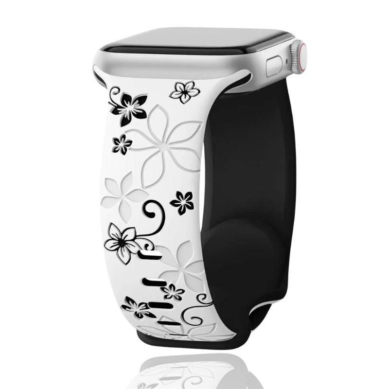 Close-up of a beautiful women's floral engraved silicone smartwatch band, highlighting the intricate floral pattern.