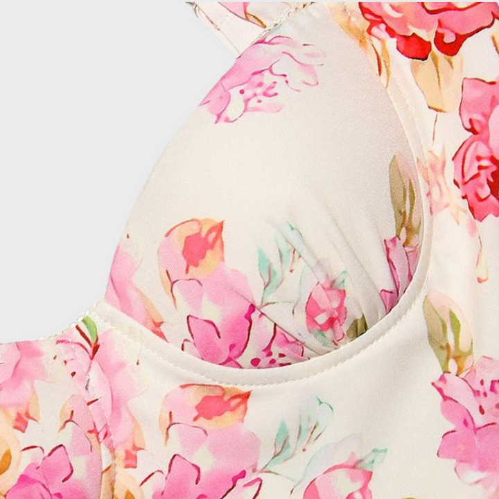 Vibrant floral print on a women's flared midi dress, perfect for warm weather