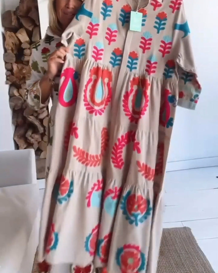 Vacation-ready women's floral midi dress with chic graphic print, an elegant summer choice.