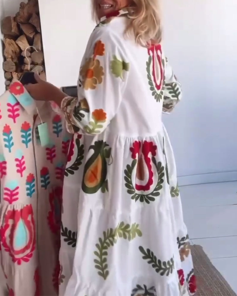 Flowy women's midi dress with vibrant floral graphic print, ideal for summer vacation.