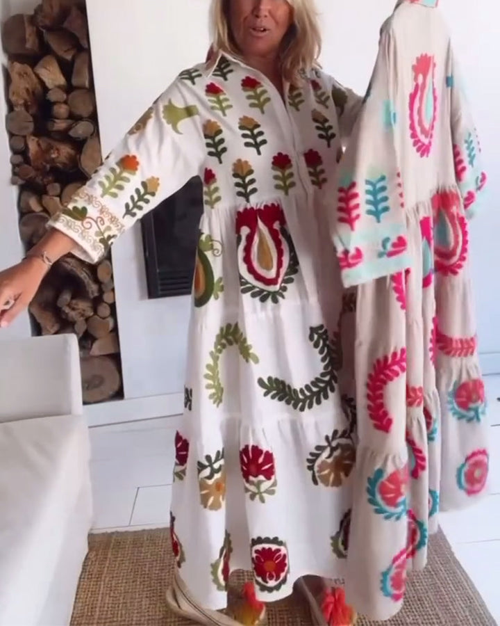Vibrant floral graphic print on an elegant women's a-line midi dress for casual outings.