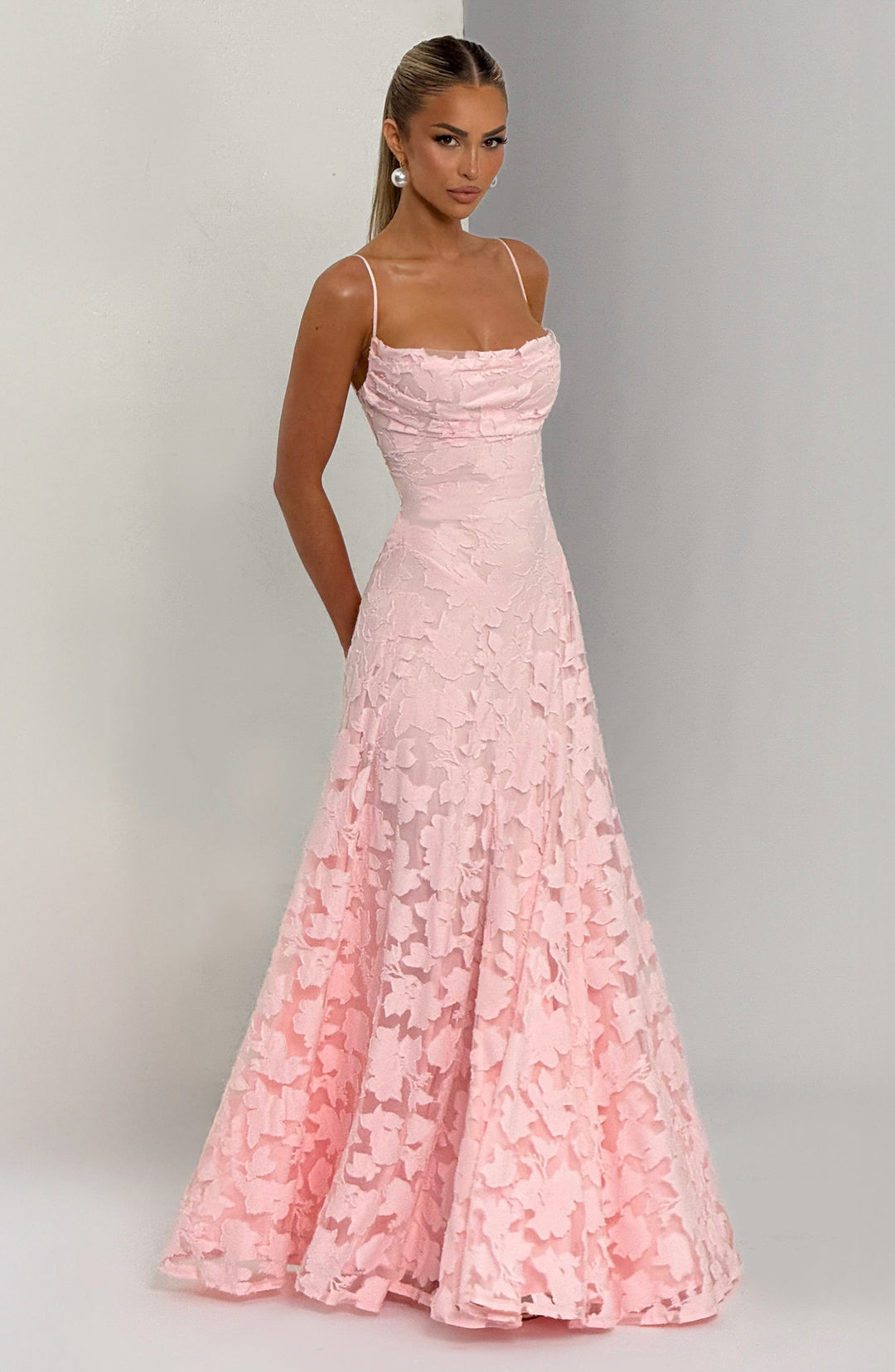 Flowy women's floral maxi dress with an A-line cut, waterfall neckline, and adjustable lace-up back.