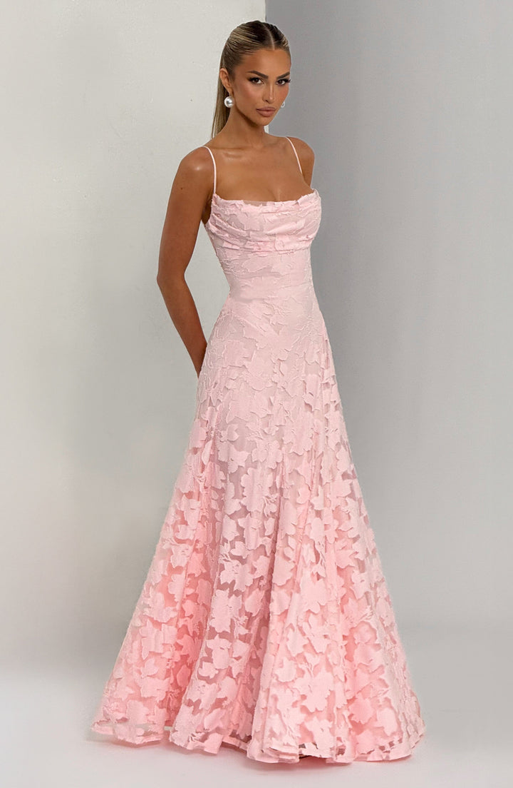 Flowy women's floral maxi dress with an A-line cut, waterfall neckline, and adjustable lace-up back.