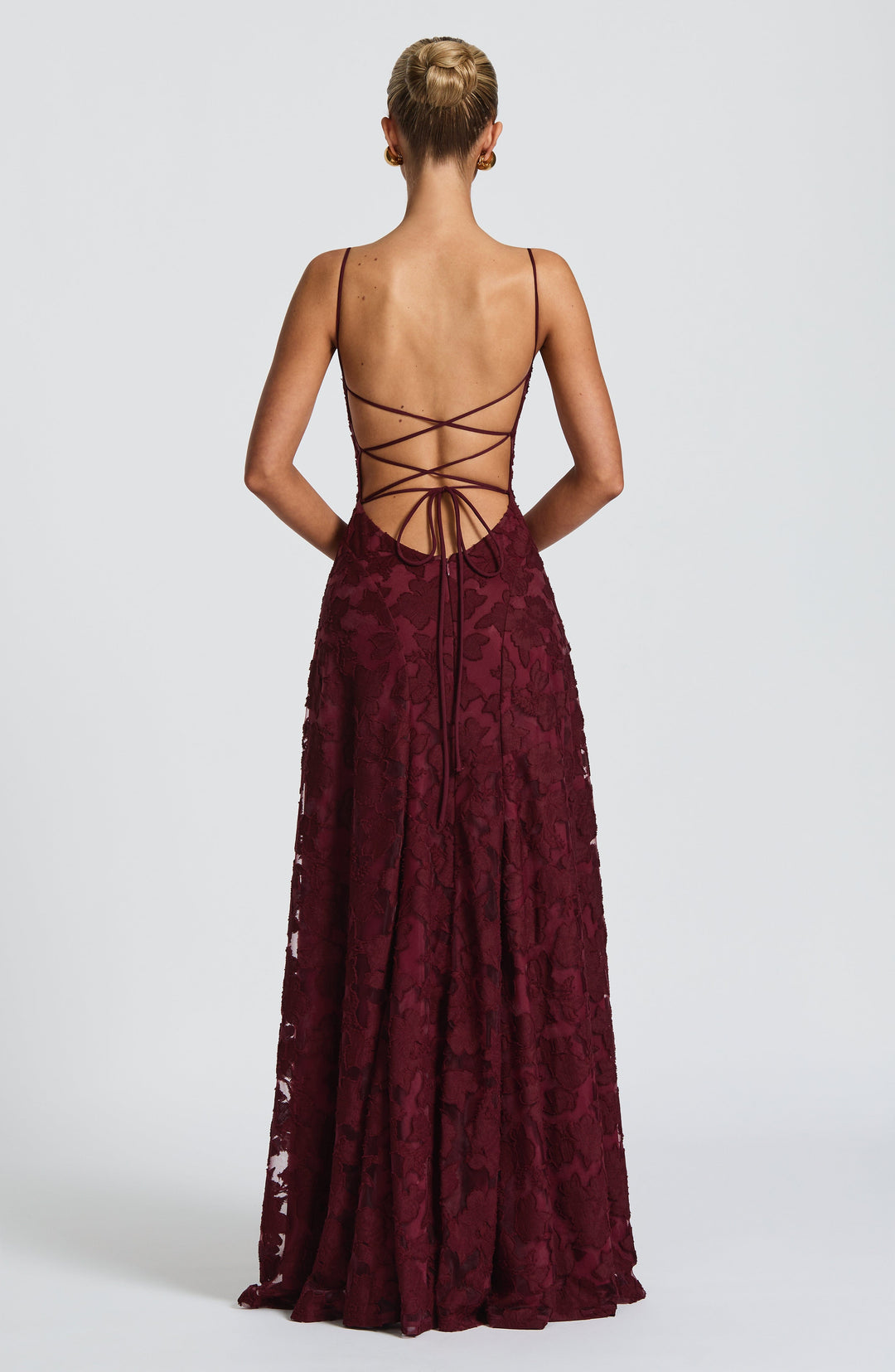 Women's A-line floral maxi dress with a flowing silhouette, waterfall neckline, and sexy lace-up back.