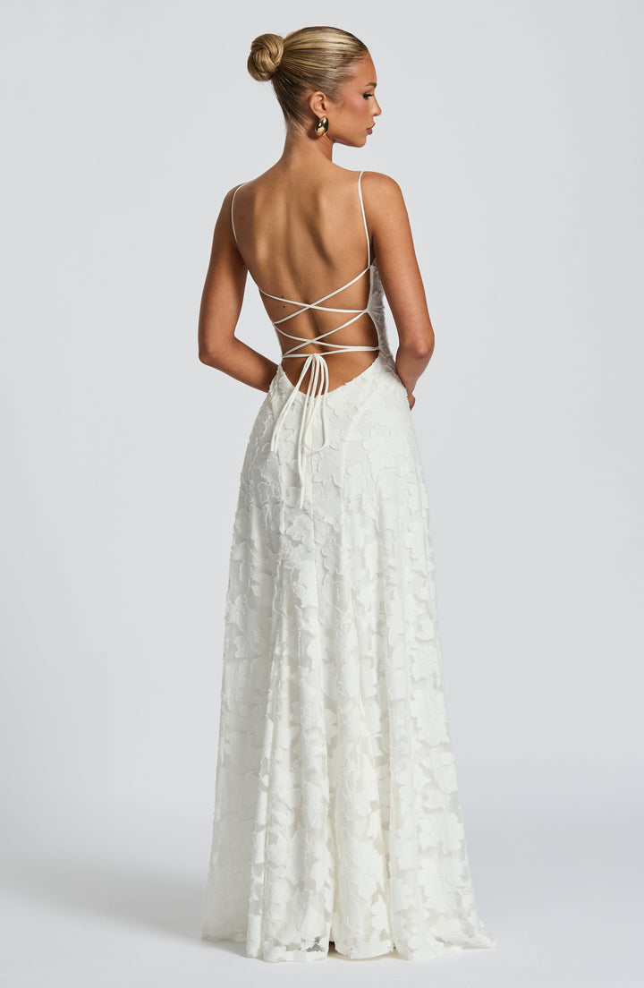 Front view of an elegant women's floral maxi dress with a sophisticated waterfall neckline.