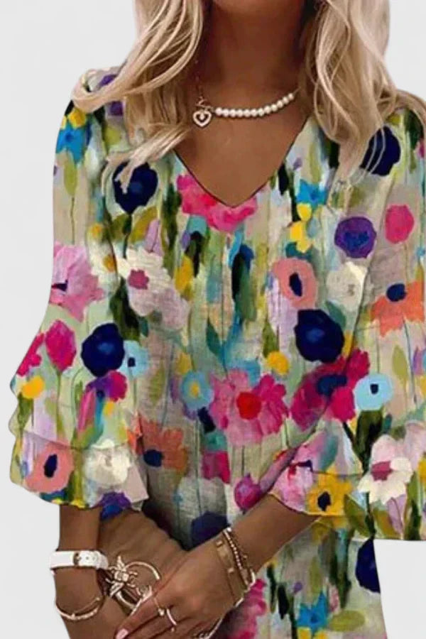 Casual women's floral print mini dress. Features a stylish V-neck and ruffled sleeves, perfect lightweight summer fashion.