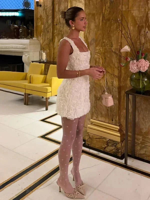 Women's stylish textured floral mini party dress, a perfect choice for celebrations.