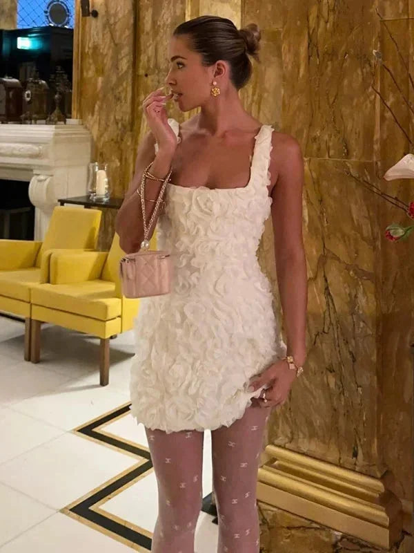 Sleeveless women's floral textured cocktail mini dress, ideal for elegant parties.