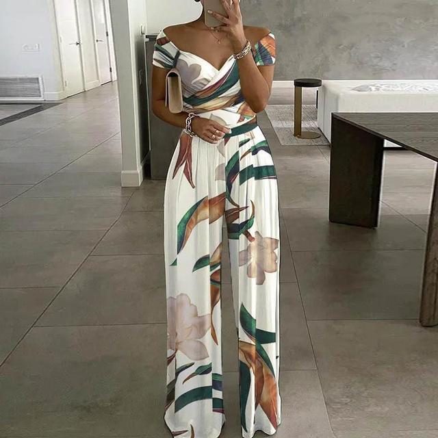 Elegant women's floral print wide-leg jumpsuit with off-shoulder design. Ideal for summer parties & vacations.
