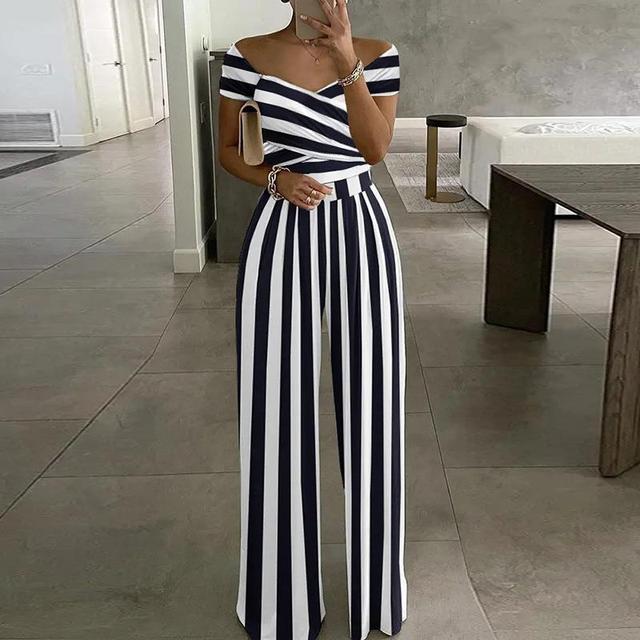 Stylish women's summer jumpsuit featuring a vibrant floral print, off-shoulder neckline & comfortable wide legs.