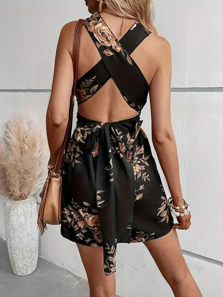 Breezy floral open-back romper, an essential summer outfit for women seeking casual elegance.