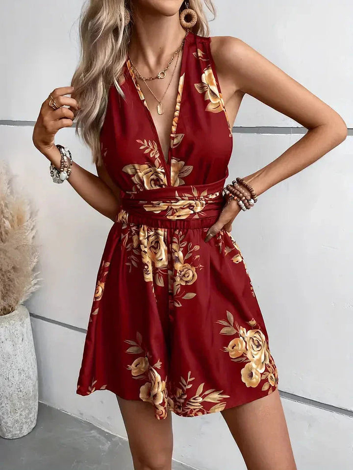 Casual chic women's floral romper dress, featuring a breezy open back for ultimate summer comfort.