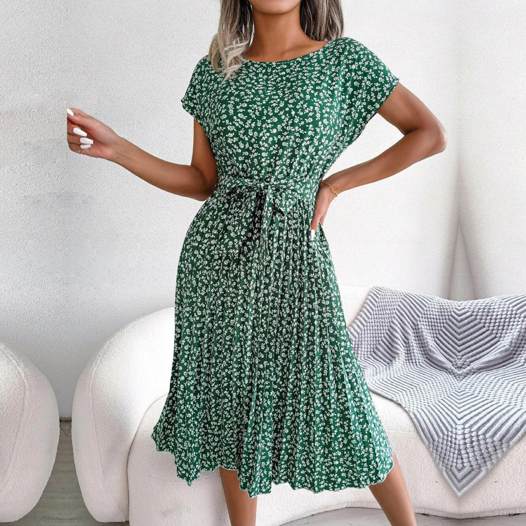 Flowy women's floral midi dress with delicate pleats, perfect for elegant spring occasions.