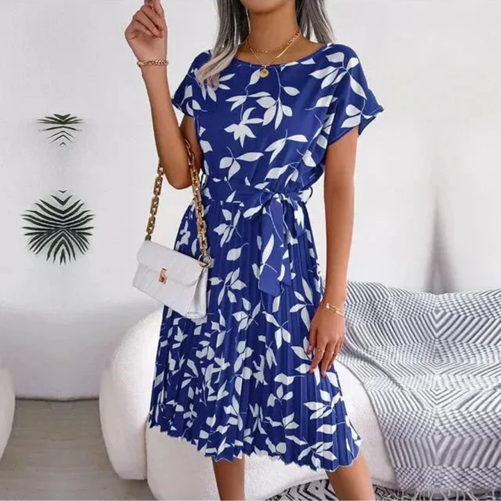 Beautiful women's floral pleated midi dress, soft fabric & comfortable fit for elegant casual style.