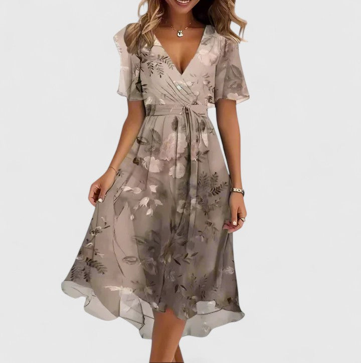 Women's floral V-neck midi dress with graceful flutter sleeves. Ideal for summer events.