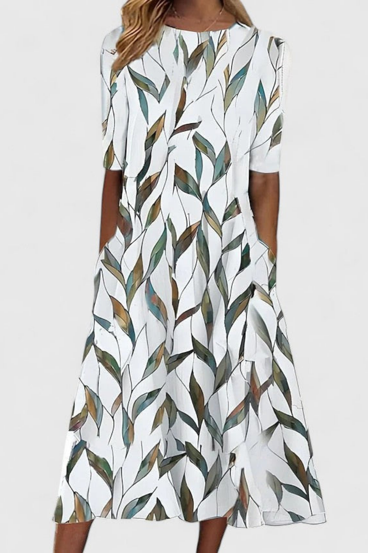 Elegant women's floral midi dress, A-line cut with relaxed flowy fit. Ideal short sleeve summer vacation or casual wear.