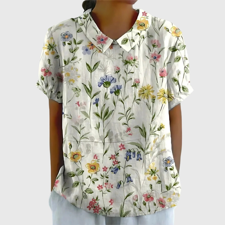 Women's floral print collared blouse. Short sleeve, relaxed fit. Perfect for summer casual chic style.