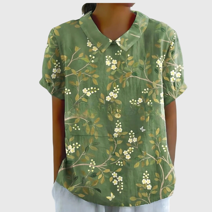 Side view of women's relaxed fit floral print blouse, offering effortless summer casual style.