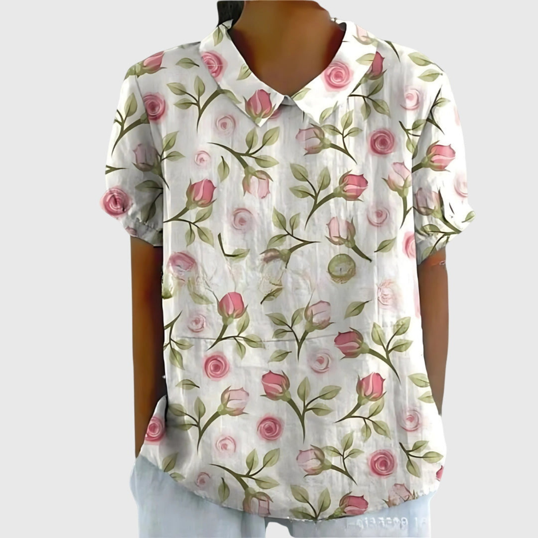 Model wears women's relaxed fit floral print blouse. Versatile for casual chic or office wear.