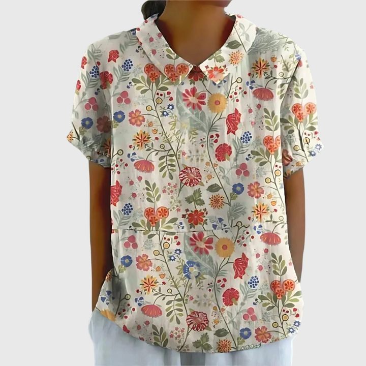 Soft fabric texture of women's floral print blouse. Comfortable top, great for all-day wear.