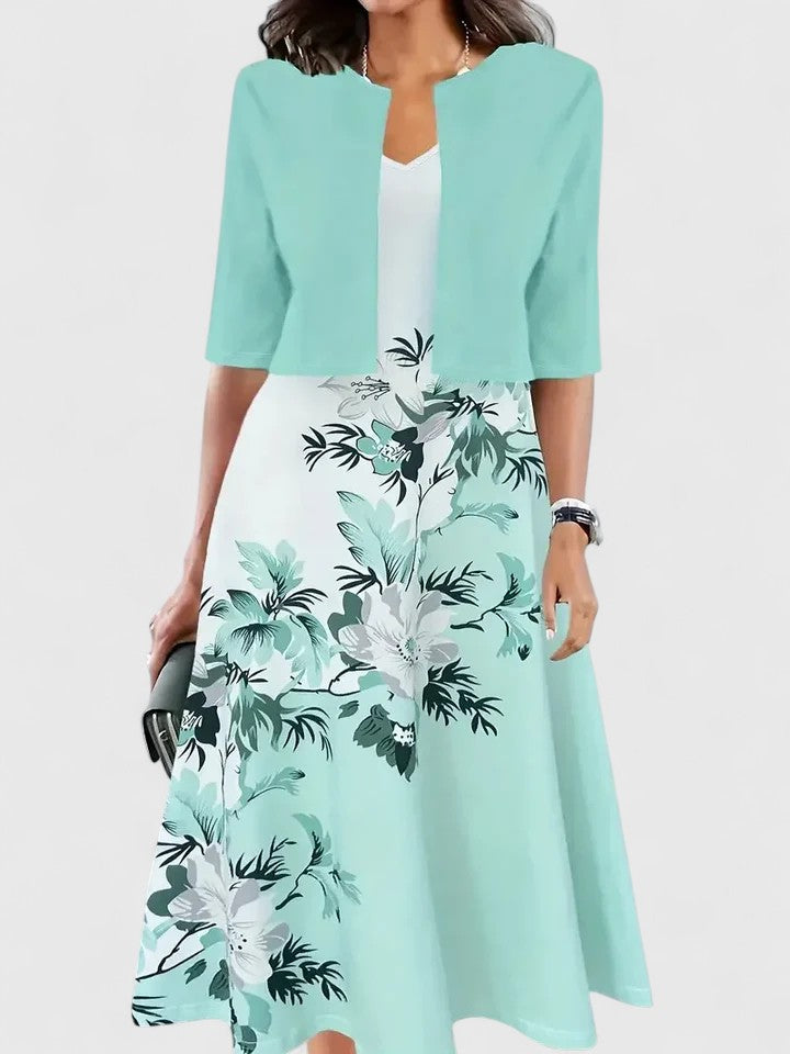 Women's vibrant floral print colorblock A-line midi dress. Perfect for garden parties and elegant events.