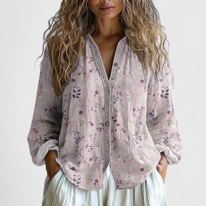 Bohemian floral print long sleeve women's blouse. Lightweight top with zip front & V-neck, ideal for spring & summer fashion.