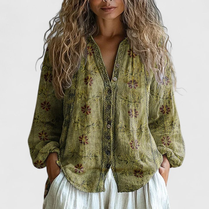 Elegant women's floral print long sleeve blouse. Features a chic zip front and V-neck, great as a casual or layering piece.