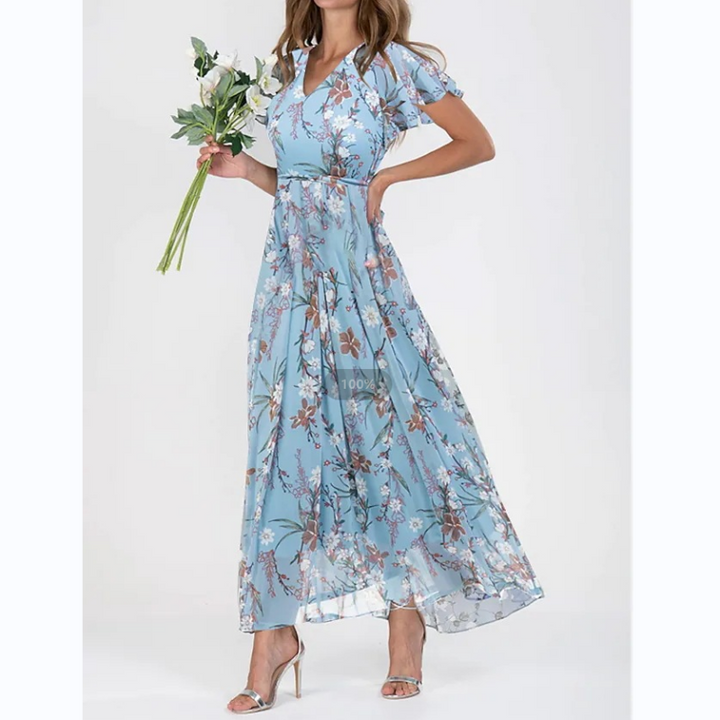 Casual yet chic women's floral print A-line maxi dress. Features delicate flutter sleeves & a flattering V-neck.
