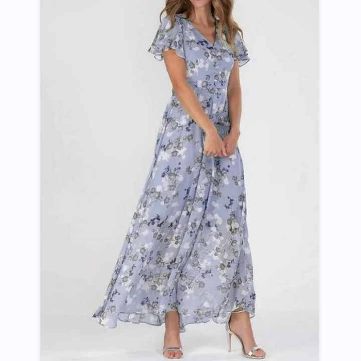 Vibrant floral print maxi dress for women with graceful flutter sleeves. A must-have V-neck summer fashion piece.